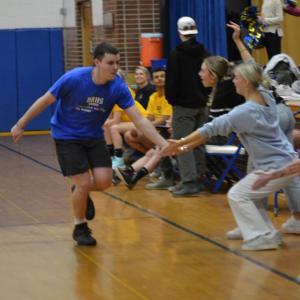 Jacob Leonard looks for some "low fives" from his coaches and teammates after nailing a 3-pointer. KEVIN BURNHAM/Boothbay Register