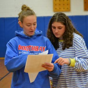 Maddie Orchard, left, and Abbie Clark figure out who won the "Huck-a-Hawk." KEVIN BURNHAM/Boothbay Register