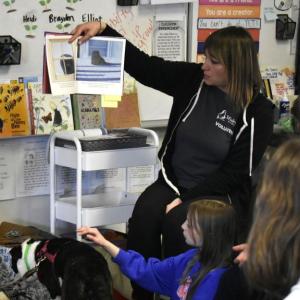 Michelle Rancourt of Midcoast Humane reads to students about Maggie the shelter dog. ISABELLE CURTIS/Boothbay Register