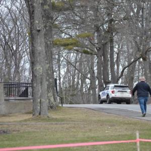 Allan Crocker walks around to the front door of the high school following the evacuation. KEVIN BURNHAM/Boothbay Register