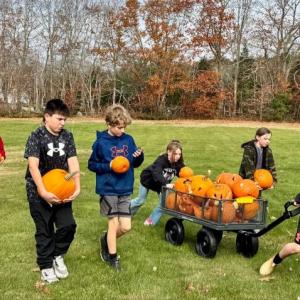 Last fall EES sixth graders were eager to deliver Math-o-lanterns to the compost area next to the school gardens. Who doesn’t love smashing pumpkins?!  Left to right:  Maxine, daughter of Pascale and Kirk Zehm; Jacob, son of Ellen and Neal Verge;  Sam, son of Daniel and Maureen Cooper;  Azalea, daughter of Laurel and Max Averill;  Andrew, son of Amanda and Andy Main;  and Mason, son of Nicole McKay and Patrick Wenners.  Students are residents of Alna and Edgecomb. Courtesy photo