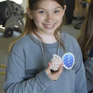 Sheyenne Upham with a decorated oyster shell. FRITZ FREUDENBERGER/Boothbay Register