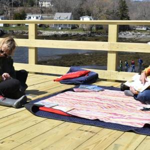 BHML Children’s Coordinator.Jen Betts hosted a reading station on the sea and science center's new pier. FRITZ FREUDENBERGER/Boothbay Register