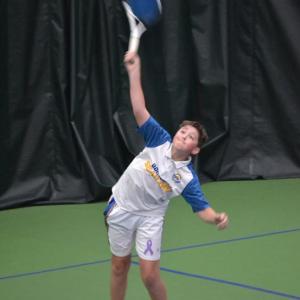 Seahawk freshman Avery Fowlie serves during his double match against Winthrop on May 7. KEVIN BURNHAM/Boothbay Register