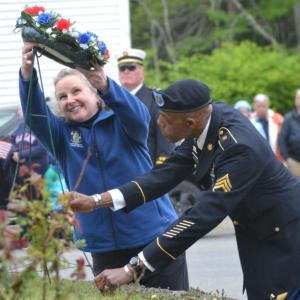 2024 Memorial Day Grand Marshal Sarah Sherman and Legion Post #36 Americanism Officer Christopher Armstead place a wreath at the Southport memorial. File photo