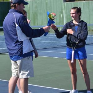Seahawk coach Alex Arsenault presents flowers to senior Laura Chapman on senior day May 14. KEVIN BURNHAM/Boothbay Register