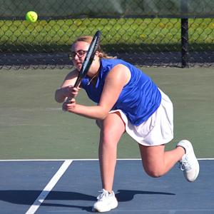 Hannah Kreft, playing second singles, makes a lunging backhand shot against Spruce Mountain May 14. KEVIN BURNHAM/Boothbay Register