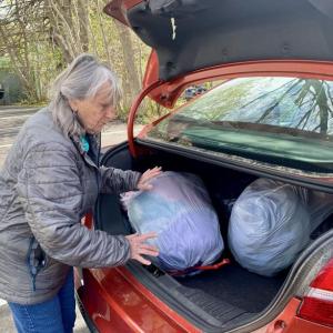 Betsy Davis loads up her car with out-of-season clothes to donate to the Salvation Army. ISABELLE CURTIS/Boothbay Register