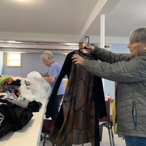 Betsy Dunton, Betty Lou Townsend and Donna Jones sort through donations every week to refresh the United Methodist Church's clothing closet.  ISABELLE CURTIS/Boothbay Register