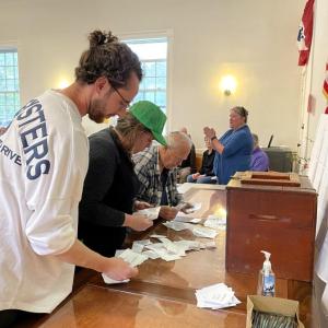 Counting written ballots for warrant Article 15. FRITZ FREUDENBERGER/Boothbay Register