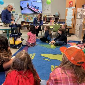 Officer Larry Brown reads a letter from the Boothbay Harbor Selectboard to Jessica Lessner’s third grade class. By Shawna Kurr
