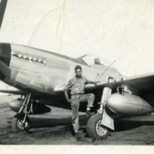 James Sheppard stands in front of a P-51 Mustang aircraft at the Ramitelli Airfield in Italy. Courtesy of Bob Sheppard
