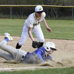 Sam Markowitz slides into first after attempting to steal against Maranacook May 13. FRITZ FREUDENBERGER/Boothbay Register