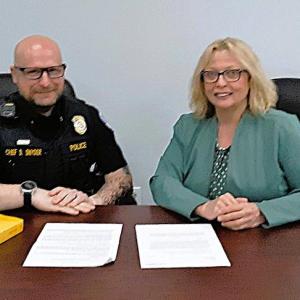 Boothbay Harbor Police Chief Doug Snyder and State Rep. Holly Stover review their bill. JANE CARPENTER/Boothbay Register Boothbay Harbor Police Chief Doug Snyder and State Rep. Holly Stover review their bill. JANE CARPENTER/Boothbay Register