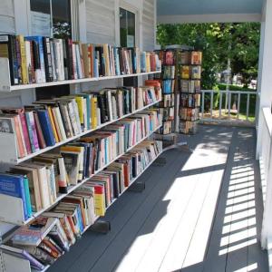 The locally famous porch at the Used Bookstore on McKown Street offers a great variety of books in exchange for a small donation. File photo