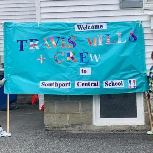 3rd graders hold welcome sign designed by Southport students. ISABELLE CURTIS/Boothbay Register