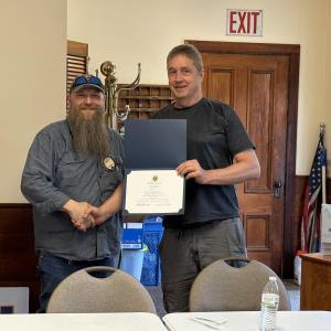 Scott Barter, left, is presented with the Boothbay Region Lions Club President's Award from outgoing club president Jay Andrews. Courtesy of Glenn Tilton