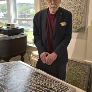 Terry Seaman, co-owner of Studio 53 discussing his latest work in memory of the Challenger crew. LISA KRISTOFF/Boothbay Register