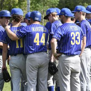 Coach Ed Crocker, left, has a word with his team before their June 3 game. FRITZ FREUDENBERGER/Boothbay Register