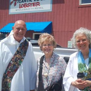 Deacon Bob Curtis, Estelle Appel and the Rev. Katherine Pinkham at the 2021 Windjammer Days’ Blessing of the Fleet. File photo