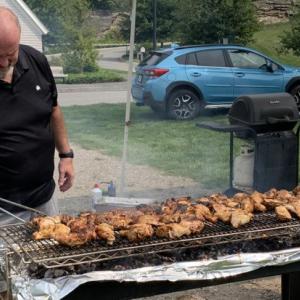 Veteran Brad Drummond tends the grill at last year's V.E.T.S. barbecue. File photo