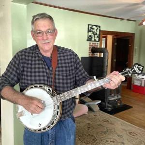 Richard “Dickie” Spofford plucks a favorite banjo, a White Lightning model, handcrafted by friend and Thomaston banjo teacher Jim Cox. A multi-instrumentalist, Spofford also plays guitar, bass, drums, and saxophone. Sherwood Olin photo