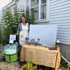 Circulation Coordinator Jane Wallace has the golden key to Wonderland (Aug. 2’s Storybook Ball) and wants you to bid on this Allen Bunker oil! Courtesy photo