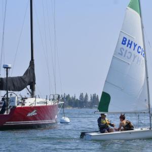 Members of the U.S. Naval Academy’s Offshore Sailing Team from the 'Wahoo' raced with Boothbay Harbor Yacht Club junior sailors in a friendly competition July 15. FRITZ FREUDENBERGER/Boothbay Register