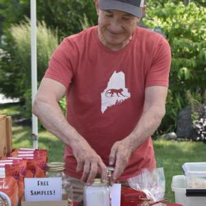 Matt Burke, owner of Sweet Monkey Business, hands out free samples of his short bread cookies. ISABELLE CURTIS/Boothbay Register
