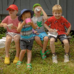 The four boys enjoyed their ice cream outside the museum on July 5. Mike Leonard photo