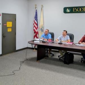 Chris Higgins, left, represents the Boothbay Harbor Sewer District at the Aug. 13 planning board meeting. FRITZ FREUDENBERGER/Boothbay Register