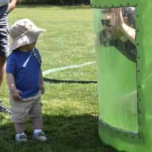 Hunter Arsenault surprises his son, Calder, from inside the dunk tank. FRITZ FREUDENBERGER/Boothbay Register