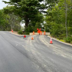 The new Adams Pond Road, left, reopened in late August. The old road, now closed, will become a vegetated buffer with a footpath. FRITZ FREUDENBERGER