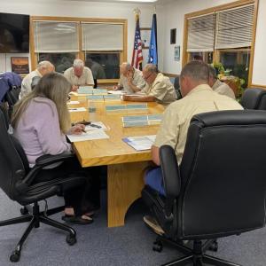 Accountant/Administrative Manager Marcia Wilson goes over the year-to-date budget with BRWD trustees. ISABELLE CURTIS/Boothbay Register
