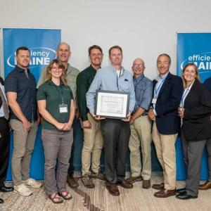 Evergreen recognized as Maine’s #1 contractor for insulation rebates by Efficiency Maine in 2025 Evergreen Home Performance team with Efficiency Maine staff at 2025 awards ceremony for top insulation rebate contractor in Maine