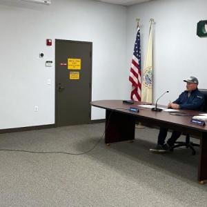 Boothbay Harbor Police Chief Doug Snyder, standing, gives the annual town parking report to the selectboard Oct. 27. FRITZ FREUDENBERGER/Boothbay Register