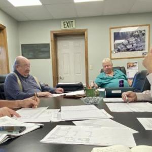 Boothbay Harbor Sewer District trustees look at a draft 2026 budget. ISABELLE CURTIS/Boothbay Register Boothbay Harbor Sewer District trustees overlook a draft 2026 budget during their first workshop. ISABELLE CURTIS/Boothbay Register