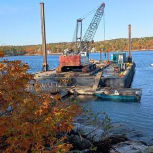 Bancroft Contracting Corporation works on the Burnt Island pier and float rebuild project. Courtesy of DMR