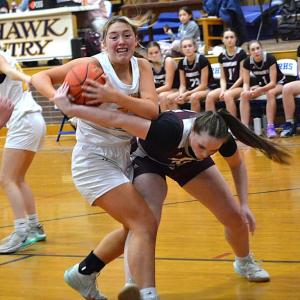 Seahawk center Tatum French takes the ball away from a Monmouth player during the second half of Wednesday's game at BRHS. French led the Seahawks with 25 points but the Seahawks lost, 47-36. KEVIN BURNHAM/Boothbay Register 