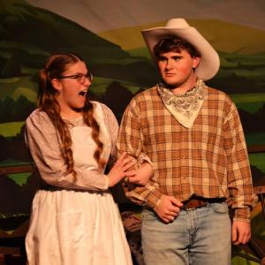Boothbay Region High School (BRHS) Drama presented three performances of Rodgers & Hammerstein’s “Oklahoma! Youth Edition” May 2 and 3 in the school’s auditorium. Here, Curly (Spencer Pottle) doesn't know what to think of the excitable Gertie (Allison Smart). KEVIN BURNHAM/Boothbay Register