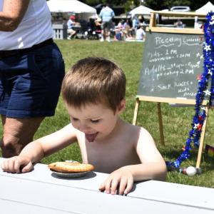 A pie eating contestant at the Boothbay Civic Association's Fourth of July celebration on the Boothbay Common. FRITZ FREUDENBERGER/Boothbay Register