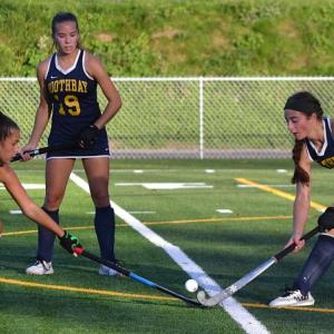 Boothbay's Zuri Smith battles a Lisbon defender as sister Moriah is nearby waiting to assist. KEVIN BURNHAM/Boothbay Register