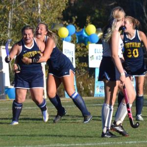 Ella Watts, left, gets a hug from fellow senior Tatum French as teammates rush in to congratulate Watts after she scored her second career goal on Monday. Watts, who normally plays defense, was inserted into the offense by coach Jax Hepburn in the third quarter in the one-sided contest. KEVIN BURNHAM/Boothbay Register