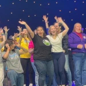 Emily Mirabile and Sophia Mansfield perform onstage with other teachers and directors at the Awards Ceremony.  Courtesy of Emily Mirabile     