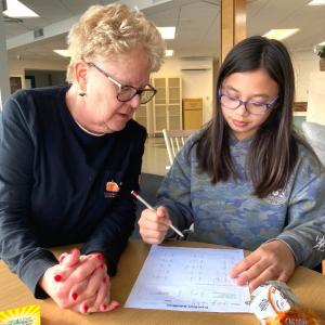 Midcoast Literacy tutor Ellen and her 5th grade learner work on math together. Katie Clark photo