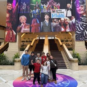 Jessie Ullo , Oscar Mirabile, Violet Baldwin, Agatha Harris and Grace Olcott in front of the festival banner at the Renaissance Waverly Hotel. Emily Mirabile photo