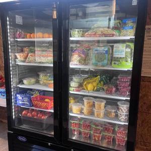 Thanks to a gift from the Mildred H. McEvoy Foundation, the Community Fridge got a new glass door refrigerator. Courtesy of Holly Stover. 