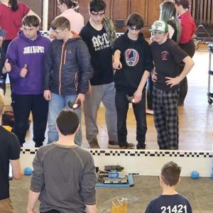 Team Popklop (from center to right, Zander Blake, Mathew Scarborough and Jayden Orne) discuss strategy. Courtesy of Chris Liberti