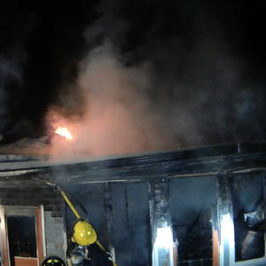 Firefighters work at containing a fire at 2 Maddocks Road in Southport on Monday, Feb. 16. Courtesy of Mark Sullivan