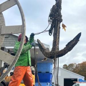 Devyn Campbell hauls in a 600-pound anchor he found during ghost gear removal. Courtesy Devyn Campbell